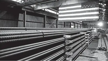  ?? JIM MONE/AP ?? Steel rods produced at the Gerdau Ameristeel mill in St. Paul, Minn. await shipment.