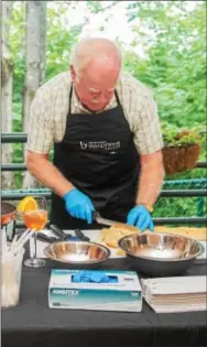  ?? COURTESY PHOTO ?? Meeting and Event Planner David Sampson prepares food at the 2015 Chester County Showcase hosted by the Chester County Conference and Visitors Bureau.