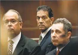  ?? Irfan Khan Los Angeles Times ?? RAMIN SALARI, center, with attorneys in 2013, faced bribery charges involving former L.A. County assessor John Noguez. Salari’s plea agreement was reversed.
