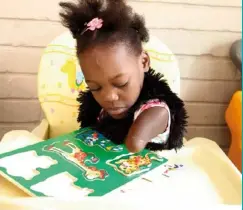  ??  ?? FAR LEFT and LEFT: Felicity enjoys playing with building blocks and puzzles, using her mouth and left stump – which is slightly longer than her right stump – to manoeuvre the pieces.