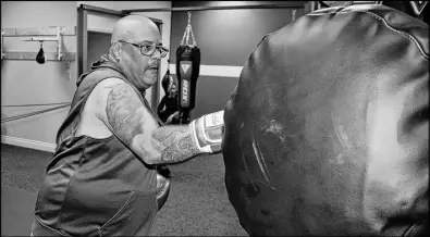  ?? FRAM DINSHAW/TRURO NEWS ?? Charles Willis is in his sixties and still dons his boxing gloves and swings his arms at the punching bags. While a recent operation on his kidneys means that he cannot box competitiv­ely as he did in his younger days, he still attends training sessions at the Beyond Boxing Fitness Studio on Truro’s Esplanade Street on weekday evenings.