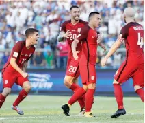  ??  ?? Bobby Wood of the US, second right, celebrates with teammates after scoring his team’s first goal during a 2018 World Cup qualifying soccer match against Honduras in San Pedro Sula, Honduras, Tuesday. The match ended in a 1-1 tie. (AP)