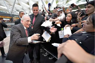  ?? (AP Photo/Marco Ugarte) ?? Director-producer Martin Scorsese signs autographs upon arrival for the premiere of the film Killers of the Flower Moon, in Mexico City, Wednesday, Oct. 11, 2023.