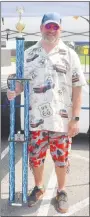  ?? Westside Eagle Observer/SUSAN HOLLAND ?? Aaron Hoyt, of Eureka Springs, displays the trophy he won for Best of Show in the benefit car show sponsored by Gravette Cruise. His 2009 Dodge Challenger also won first place in the Special Interest Class.