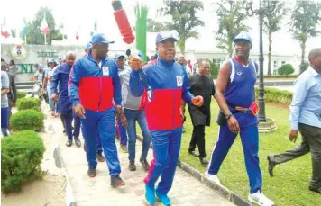  ??  ?? Imo State Governor, Emeka Ihedioha with the Unity Torch; Executive Chairman, Imo Sports Commission, Chief Fan Ndubuoke; among others before the flag off of the 13th Imo Sports Festival at the Government House, Owerri…yesterday.