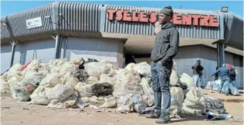  ?? /SIVIWE FEKETHA ?? Thabang Madikila found his fledgling business broken into and cleaned out as looters rampaged through Tsele’s Centre in Moletsane, Soweto.