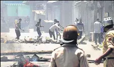  ?? HT FILE ?? A protester throws a stone at policemen during clashes in Srinagar, after Hizb commander Burhan Wani was killed in July 2016.