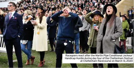 ??  ?? Racegoers react after the Martin Pipe Conditiona­l Jockeys’ Handicap Hurdle during day four of the Cheltenham Festival at Cheltenham Racecourse on March 13, 2020
