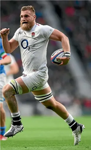  ?? GETTY IMAGES ?? Former Hurricanes loose forward Brad Shields races away to score one of his two tries in England’s convincing win over Italy.