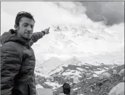  ?? ASSOCIATED PRESS ?? IN THIS IMAGE RELEASED BY LYMBUS, Kilian Jornet from Spain points towards Mount Everest in 2017.