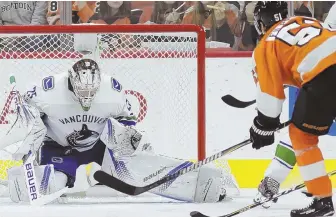  ?? AP PHOTO ?? SUCCESSFUL ROAD STOP: Jacob Markstrom makes a save on the Flyers’ Valtteri Filppula during the Canucks’ 5-2 victory last night in Philadelph­ia.