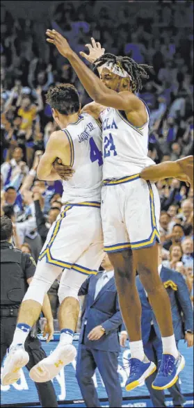  ?? Ringo H.W. Chiu The Associated Press ?? UCLA guard Jaime Jaquez Jr. and forward Jalen Hill celebrate after the Bruins’ win over Arizona State on Feb. 27 at Pauley Pavilion.