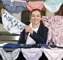  ?? PHOTO: KEVIN FARMER ?? YOUNG LEADER: St Ursula’s College student Ella Boyd with underwear collected for her Say No to Commando campaign.