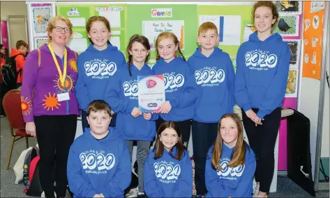  ??  ?? Some of the 6th class pupils from St Colman’s National School with teacher Cathy Tighe at the Primary Science Fair with their project ‘Feed the Birds’.