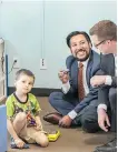  ?? SHAUGHN BUTTS ?? Derek Willis, 5, plays among NDP MLAs Ricardo Miranda, left, and Jon Carson, at Children’s Autism Services of Edmonton (CASE). CASE provides assistance for Derek and his mother.