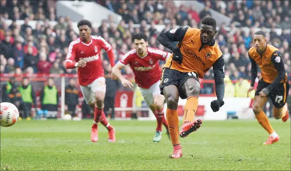  ?? PICTURES: Action Images ?? BAK IN THE RACE: Wolves are now level on points with fellow play-off chasers Ipswich and Derby after Bakary Sako’s decisive penalty