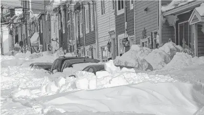  ?? KEITH GOSSE/THE TELEGRAM ?? Vehicles sit buried in downtown St. John’s Sunday.