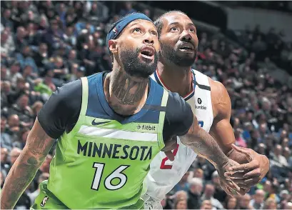  ?? DAVID SHERMAN NBAE VIA GETTY IMAGES ?? James Johnson had 15 points, three rebounds, five assists and two steals in a Timberwolv­es win over the Clippers on Saturday.