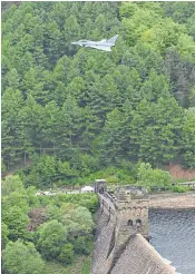  ??  ?? Clockwise from left, Squadron Leader George ‘Johnny’ Johnson, Britain’s last surviving Dambuster; an RAF Typhoon flies over the Derwent dam in Derbyshire after a Lancaster fly-past was cancelled; gloves laid out at the Bomber Command Memorial; the...