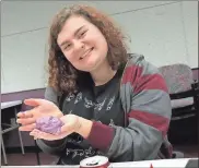  ??  ?? Purple was the color of choice for this teen making her own Playdoh out of marshmallo­ws, coconut oil and corn starch. (Catoosa News photo/Tamara Wolk)