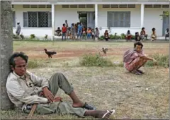  ?? PHA LINA ?? Detained people sit around the grounds of the notorious Prey Speu centre situated on the outskirts of Phnom Penh in 2015.