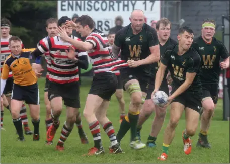  ??  ?? Boyne full back Robert Vallejo tries to instigate a back line move against Enniscorth­y.