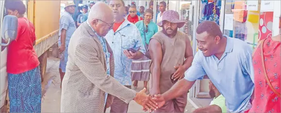  ?? Picture: BALJEET SINGH ?? Opposition Leader and SODELPA interim leader Sitiveni Rabuka shakes hands with people in Sigatoka Town during the Opposition listening tour of the Western Division.