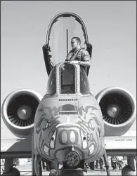  ?? Special to the Arkansas Democrat-Gazette/Arkansas Air National Guard ?? A member of the former 188th Fighter Wing, based at Fort Smith, stands in the cockpit of an A-10 during a deployment to Afghanista­n in 2010. The unit, now the 188th Wing, saw the last of its 20 Warthogs reassigned to other bases earlier this year.