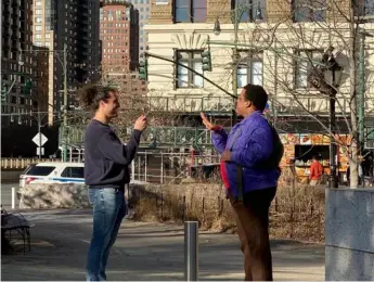  ?? Hunter Prosper ?? Bloomfield resident and TikTok creator Hunter Prosper, left, films an interview subject participat­ing in his “Stories from a Stranger” series.