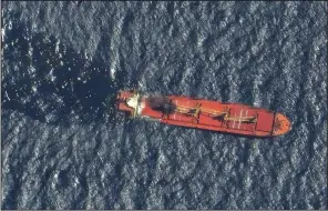  ?? (AP/Maxar Technologi­es) ?? The Belize-flagged ship Rubymar is shown in the Red Sea on Friday as it was taking on water from an earlier attack by Yemen’s Houthi rebels.