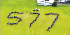  ??  ?? Students from Auckland Normal School produce the number 577, the number of lives saved in 2019.