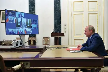  ?? Associated Press ?? ■ Russian President Vladimir Putin chairs a Security Council meeting Friday via video conference in Moscow.