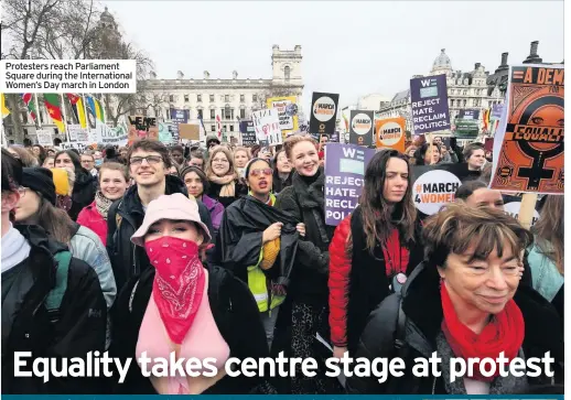  ??  ?? Protesters reach Parliament Square during the Internatio­nal Women’s Day march in London
HUNDREDS of people marched down Whitehall in support for Internatio­nal Women’s Day yesterday.
There was a heavy emphasis on the growing climate crisis at this year’s event and the impact it is having on women in some of the poorest parts of the world.
Marchers carried signs
Toksvig said she was “getting impatient” at the slow rate of change in both achieving gender equality and tackling the climate crisis.
She told the PA news agency: “I celebrate Internatio­nal Women’s Day every year but I don’t see big movement. We need change and we need it now.”