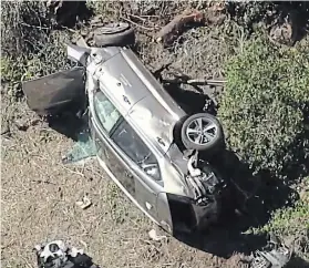  ?? THE ASSOCIATED PRESS ?? In thisimage take from video provided by KABCTV video, a vehicle rests on its side after a rollover accident involving golfer Tiger Woods near Los Angeles on Tuesday.