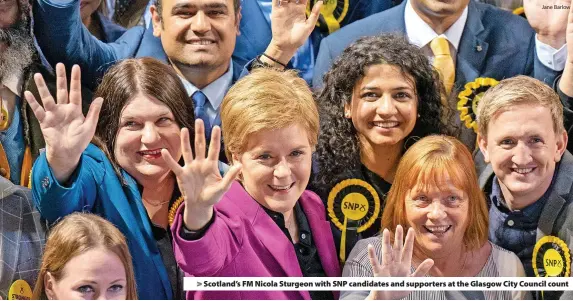  ?? Jane Barlow ?? > Scotland’s FM Nicola Sturgeon with SNP candidates and supporters at the Glasgow City Council count
