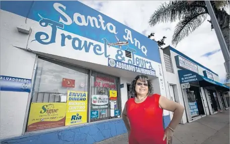  ?? Allen J. Schaben Los Angeles Times ?? SYLVIA AREVALO, shown in May, runs Santa Ana Travel & Tours, an agency that caters to Salvadoran­s. Some of Arevalo’s clients who used to travel regularly are no longer making trips to El Salvador, she said. Others are choosing to fly out of Tijuana...