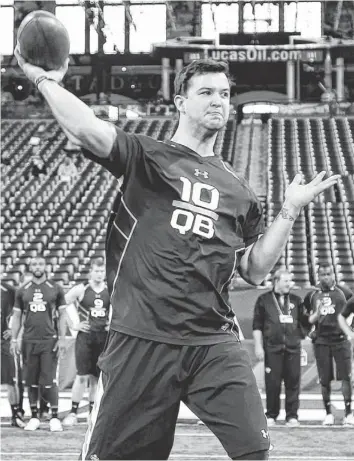  ?? BRIAN SPURLOCK, USA TODAY SPORTS ?? AJ McCarron, above, showed a strong arm but missed some out routes Sunday at the combine. “I thought he looked good in virtually every facet,” ex-Colts general manager Bill Polian said.