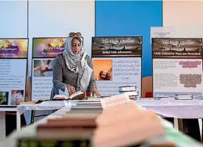  ?? ANDY JACKSON/FAIRFAX NZ ?? Rukshana Khan, wife of National President Bashir Khan, helped to set up the hall at the Holy Quran Exhibition in Fitzroy Hall.