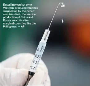  ?? — AP ?? Equal immunity: With Western-produced vaccines snapped up by the richer countries first, the vaccine production of China and Russia are critical for marginal countries like the Philippine­s.