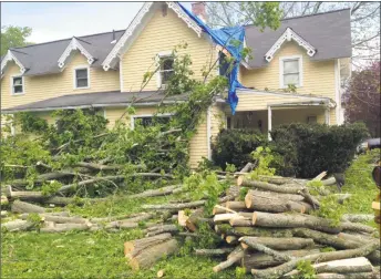  ?? Leslie Hutchison / Hearst Connecticu­t Media ?? Two big maples broke in half and crashed into the roof of this home on Walnut Street in Winsted. The home was built in 1901.