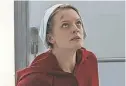  ?? HULU ?? Offred (Elisabeth Moss) must move beyond the source material for Season 2 of “The Handmaid's Tale.”