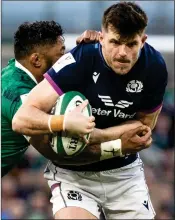  ?? ?? A BAPTISM OF FIRE: Blair Kinghorn struggles to make headway for Scotland against the mighty Irish