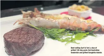  ??  ?? Best-selling Surf & Turf, a duo of grilled 120- day grain-fed Australian tenderloin and grilled Songkhla lobster.