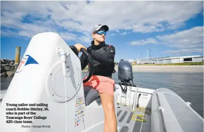  ?? Photos / George Novak ?? Young sailor and sailing coach Robbie Shirley, 16, who is part of the Tauranga Boys’ College 420 class team.