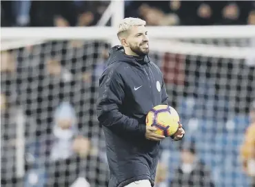  ??  ?? 0 Sergio Aguero carries off the matchball after scoring his 15th hat-trick for Manchester City.