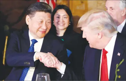  ?? AP PHOTO ?? President Donald Trump, right, shakes hands with Chinese President Xi Jinping during a dinner at Mar-a-lago, in Palm Beach, Fla. Trump begins a state visit to Beijing Wednesday.