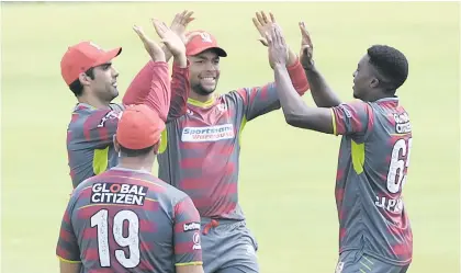  ?? Picture: Gallo Images ?? MADE TO WORK. Tshwane Spartans fast bowler Lutho Sipamla (right) took three wickets yesterday as they won a close game against the Paarl Rocks in Centurion yesterday by four wickets.