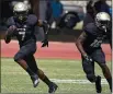  ?? MATT BATES — ENTERPRISE-RECORD FILE ?? Butte College’s Jamal McMurrin runs upfield behind Demarco Fishback against Laney on Saturday, Sept. 11, in Butte Valley.