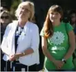 ??  ?? Elizabeth May and her daughter Victoria Cate May Burton listen at a rally in Vancouver on Saturday.