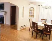  ?? ?? Hardwood flooring fills the dining room and flows into the formal living room.